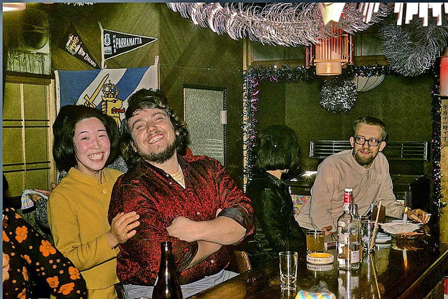 1972-02-044 - but inside the small, warm and cozy Japanese bars, - the outside snowstorm and freezing cold seems far away - Here seaman Musante and other 