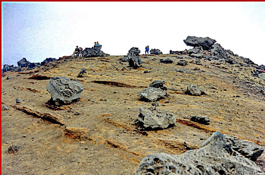 1991-10-017  -  Hallasan -  Is this the Moon???? - -A view of the crater rim studded with volcanic rocks. - the crater is to the left, - and down mountain is to the right - (Photography by Karsten Petersen)