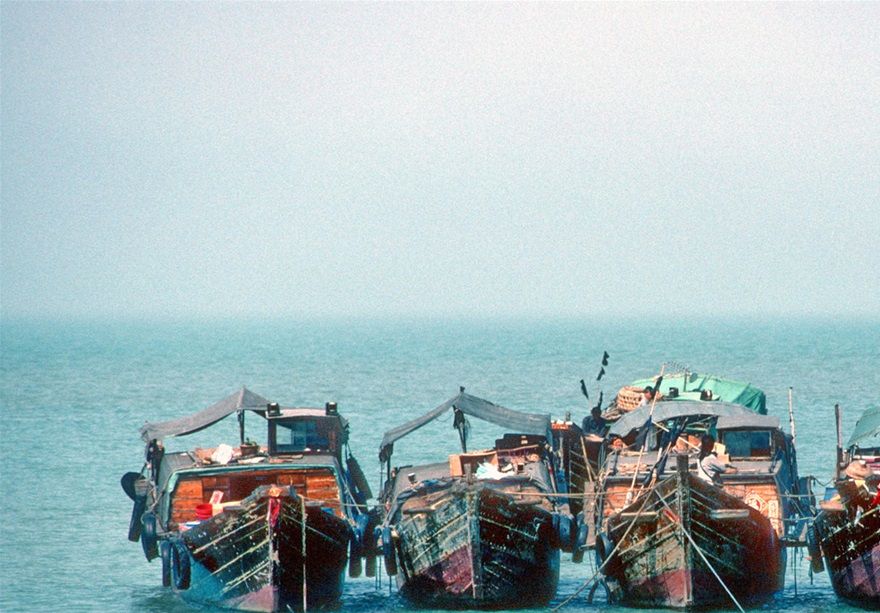 1996-07-011  - The smuggler boats still at anchor outside the coast!  What are they waiting for?