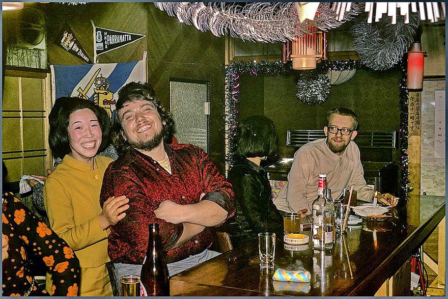 1972-02-044 - but inside the small, warm and cozy Japanese bars, - the outside snowstorm and freezing cold seems far away - Here seaman Musante and other 