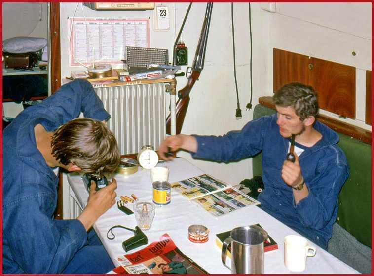SKA 4 - Jan and Jørgen in the main cabin - (The shot gun on the wall is NOT navy armament, but we used it for hunting.) (Photography by Karsten Petersen ©)
