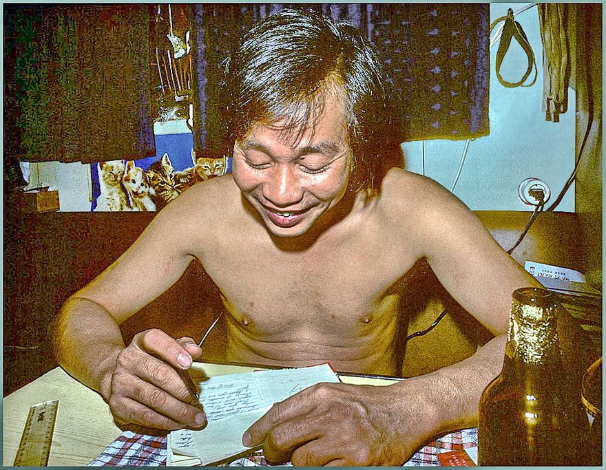 1977-05-05 - Chan Lap Chung writing a love letter. (Actually it was my job to do rough drafts, since my English was considerably better than his, but he had to do the actual writing himself!) -  (Photography by Karsten Petersen ©)