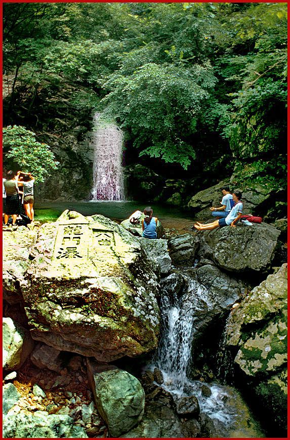 1997-18-025 -Kyeryongsan The Yongmun falls are by no means big or impressive, but it is a very lovely spot, - and as you can see on this picture -, it is also a great place for a meditative moment in harmony with the universe - (Photography by Karsten Petersen)