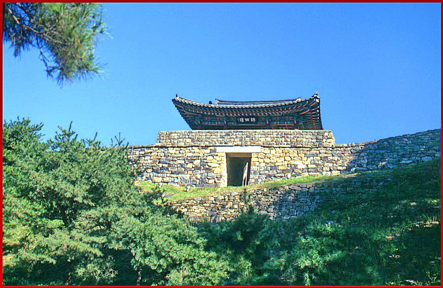 2000-27-033 - The Kongsansong fortress gate - as it normally appears, - peaceful in the morning light - Little did I know, that the next day these old walls would be manned by Paekche warriors and colorful banners. -  (Photography by Karsten Petersen)