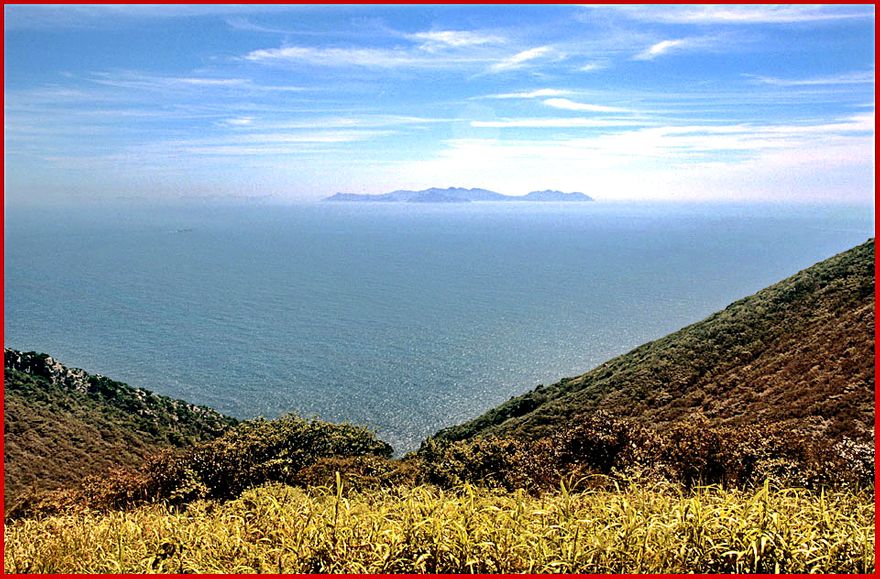 1997-22-040 - Hongdo A rare view! In clear visibility, you can see the neighbour island,- Huksando in the horizon. Behind Huksando,- and many more islands-, you find the Korean mainland some 115 km. away! (Photography by Karsten Petersen)