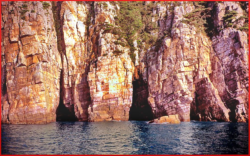 1997-23-007 - Hongdo - a final view, - one of Hongdo's vertical walls, - straight into the sea - (Photography by Karsten Petersen)