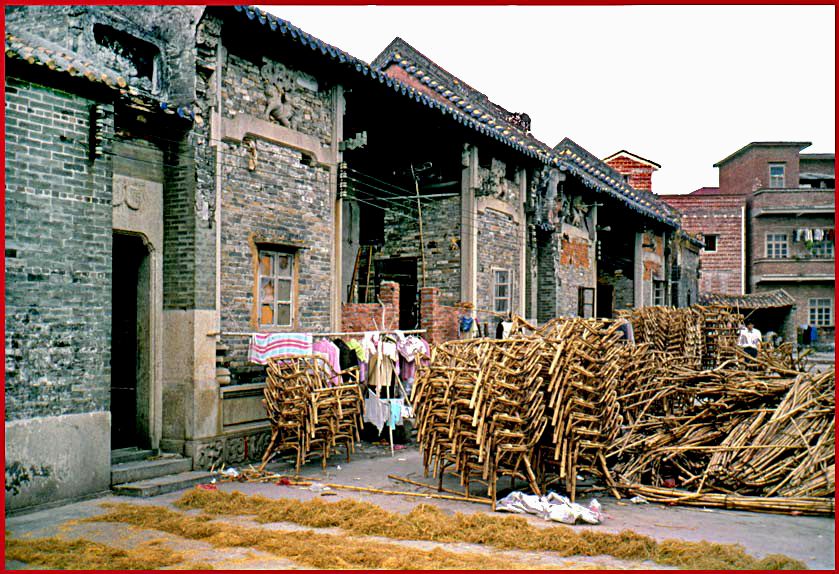 2003-14-031  - The old village temple in Shen Chun.  During the Mao period it is estimated that 75000 buddhist temples were destroyed and disappeared.  However - some survived the madness and the fury of the Red Guard being converted to bicycle repair shops or tea houses - or like this one to a chair factory - - - (Photo- and copyright:  Karsten Petersen)
