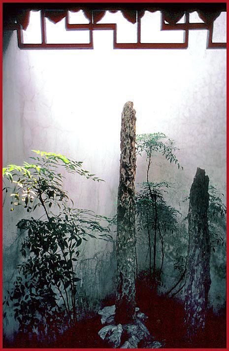 2002-32-V16  - An indoor classic garden , - in perfect harmony - this very beautiful arrangement of plants and rocks we found inside Wu Zixu's memorial temple in Suzhou - (Photo-and copyright: Karsten Petersen)