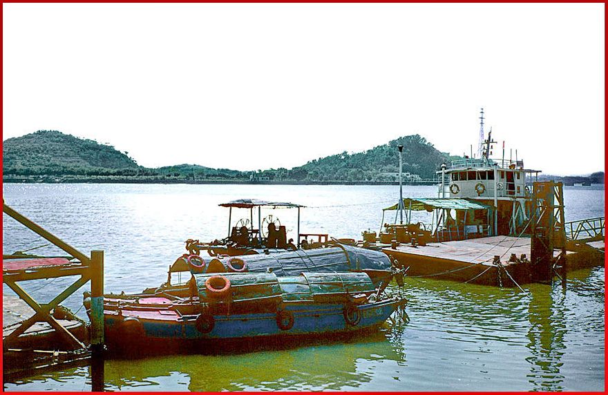 2003-10-084  - Whampoa Island, - at the ferry station to Danes Island. - Danes Island in the background, - showing Cemetery Hill behind the small river boat to the right - (Photo- and copyright: Karsten Petersen)