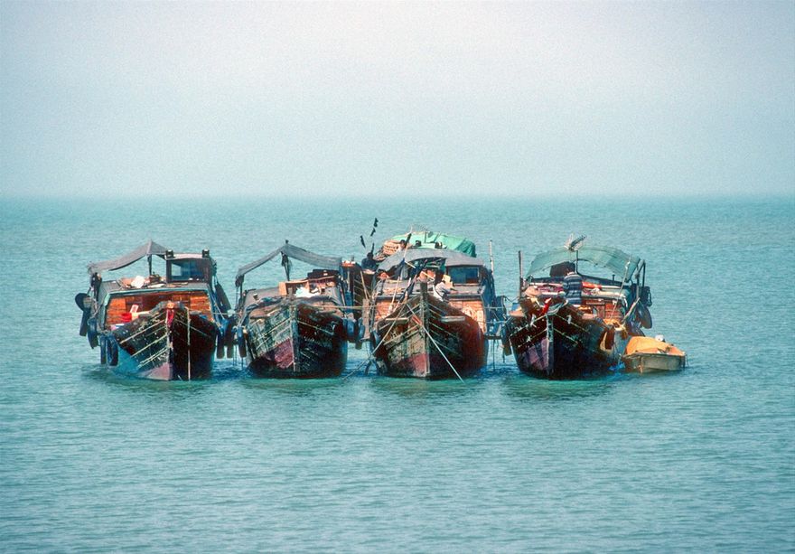 1996-07-011  - The smuggler boats still at anchor outside the coast!  What are they waiting for?