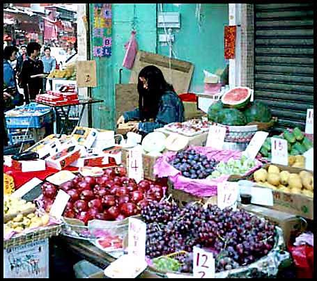 Hong Kong street vendor selling fruit - date/place not known at the moment - (Photo-and copyright:  Karsten Petersen)