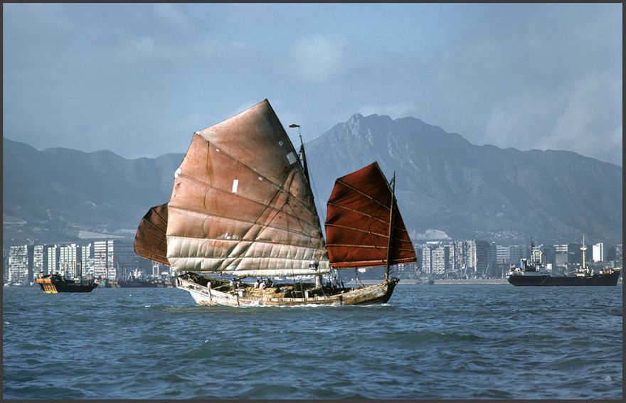 1977-04-064  -  Chinese Junk - in Hong Kong harbour, - May 1977 - - the mountain behind is Lion Rock, - a well known landmark in Hong Kong - (Photo- and copyright: Karsten Petersen )