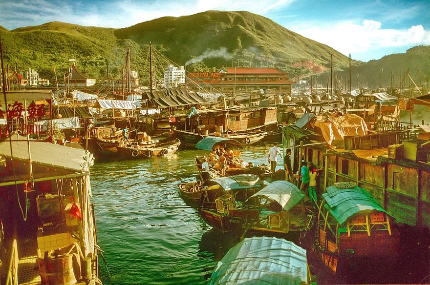 1973-04-055  -  Chinese Junks - Aberdeen Harbour with its floating city of junks, Hong Kong, - autumn 1973. The well known, - and huge -,  floating restaurants in the harbour are seen in the background -  (Photo- and copyright:  Karsten Petersen)