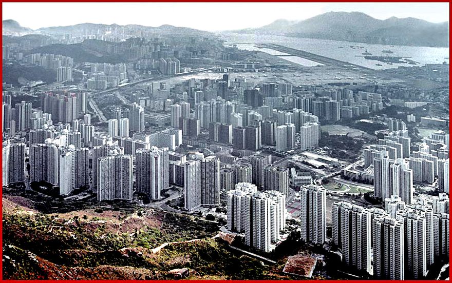 1997-02-060  - A view from another direction, - the Kowloon side. - a misty look over Tsz Wan Shan apartments, - and Kai Tak Airport in the background  -  (Photo- and copyright:  Karsten Petersen)-