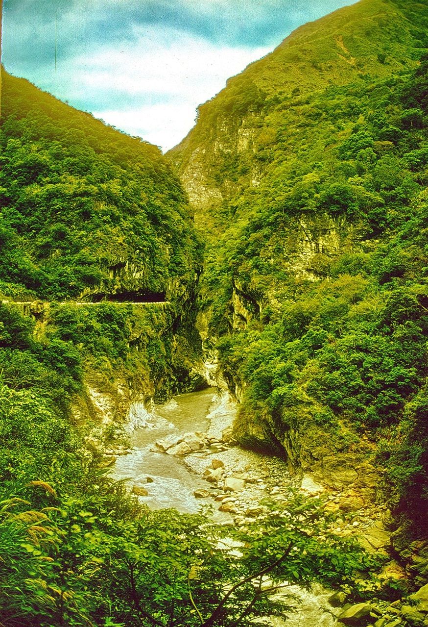 1973-13-027  -  The Liwu river as it twists and turns through the gorge - - -  The road along the river can be seen  in the background - carved into the cliff face - - --