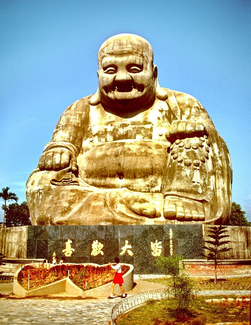 1973-13-079  -  Also in the Taichung area - and not far from the Baguashan big Buddha you can find an even bigger one - 27 meters tall .  It's the Milefo Buddha at the Baojue Temple - - - I only took this one photo of Milefo because he is so big - and NOT because I particularly like this type of Chinese 